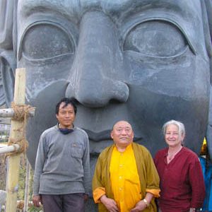 Master Sculptor Tashi Norbu, Venerable Wangdor Rimpoche, Lama Lena up on statue scaffolding.